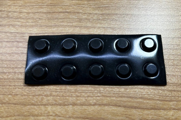 Black round BumpOns (Tactile Markers).
